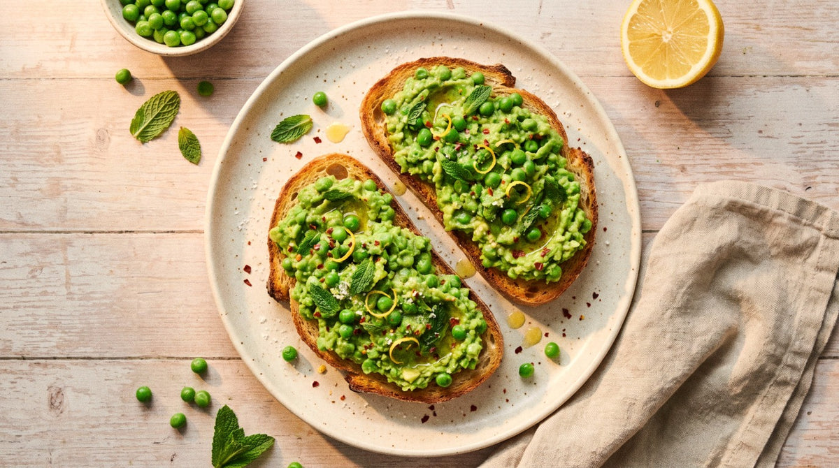 Sourdough toast piled with smashed peas and avocado, fresh mint and lemon zest, seasoned with Chooki's Zest Chicken Salt