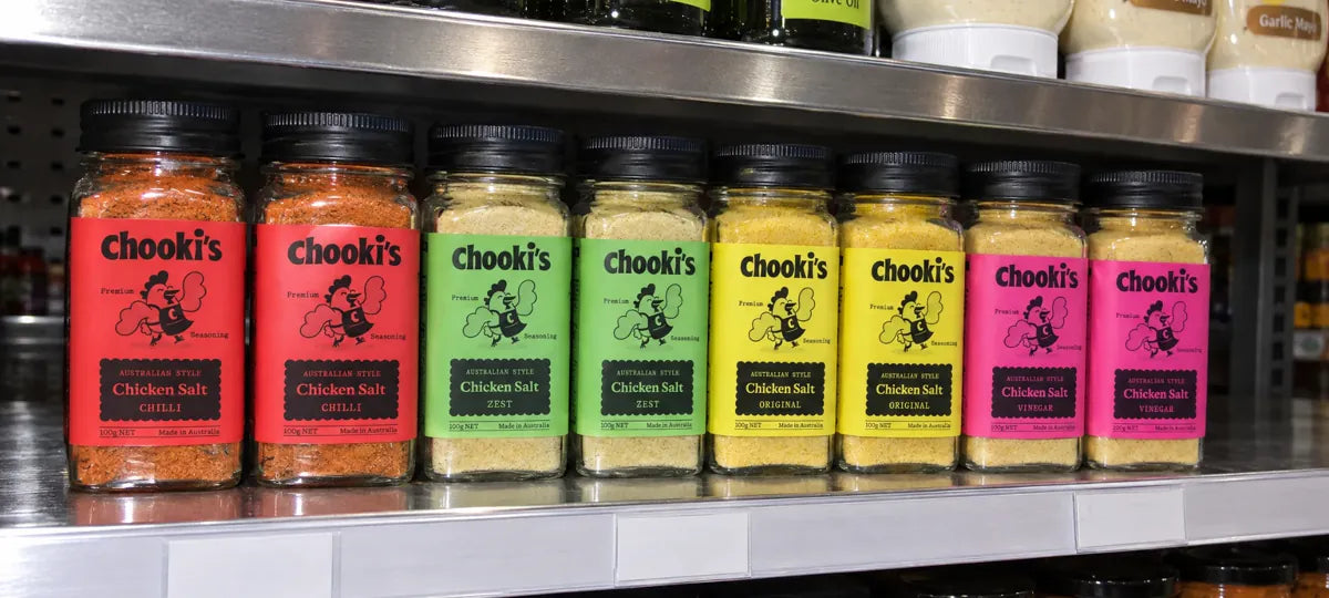 Chooki's Chicken Salt jars in Chilli, Zest, Original and Vinegar on a shop shelf